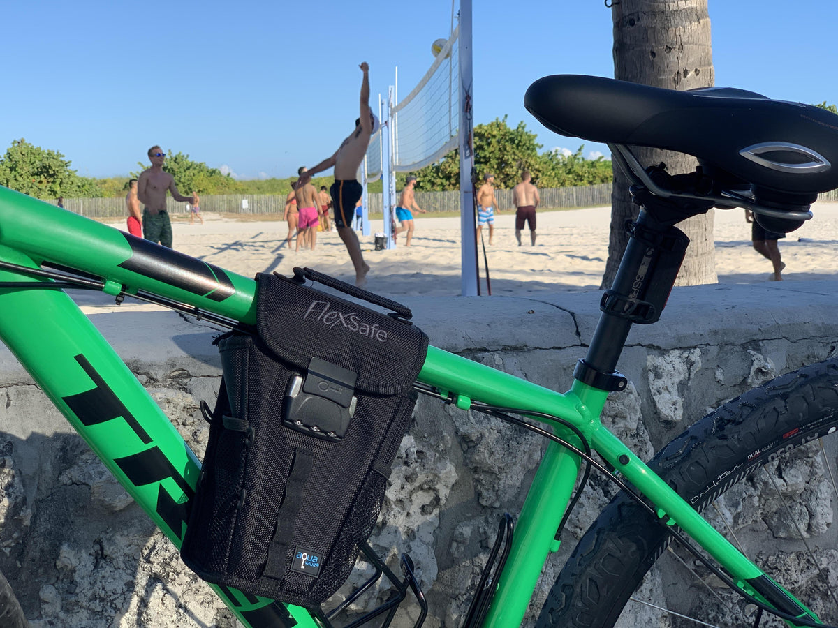 The Portable Travel Safe On Green Bike with Volleyball In Background