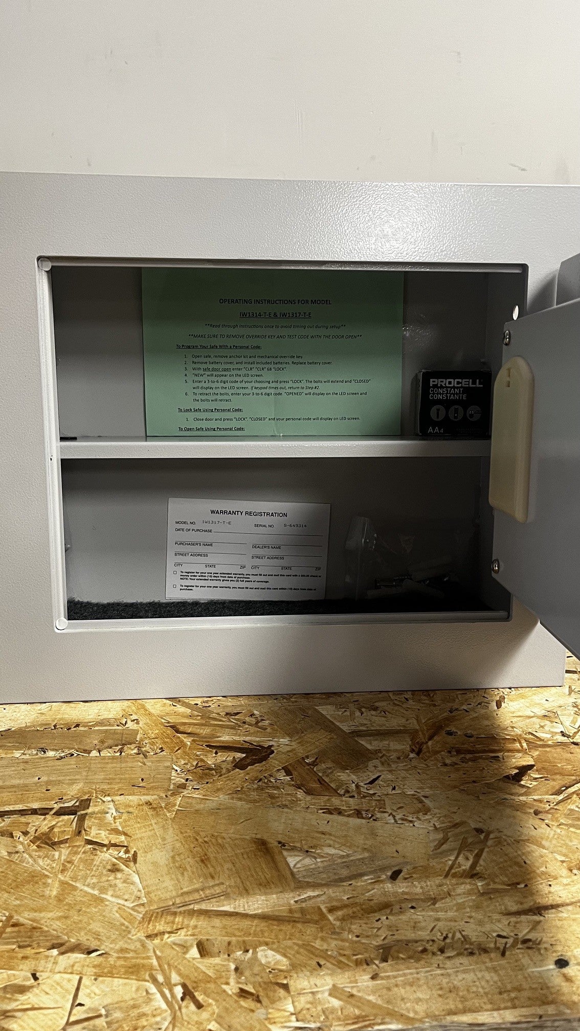 View of the inside of the safe. It comes with one removable shelf. The hardware needed for the installation is included as well. 
