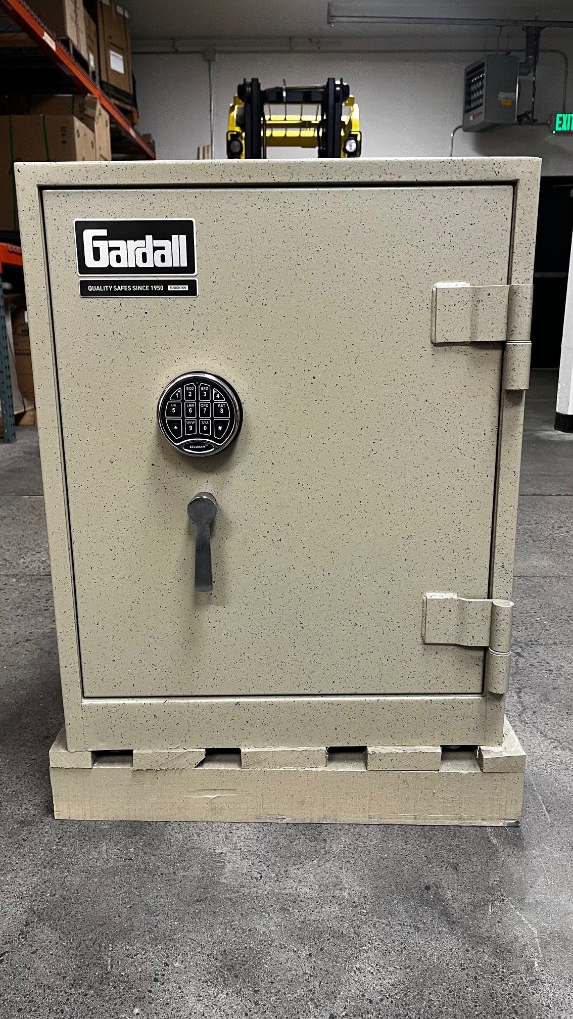 Front view of the safe. It has a sliver handle with a sliver digital electronic lock. 