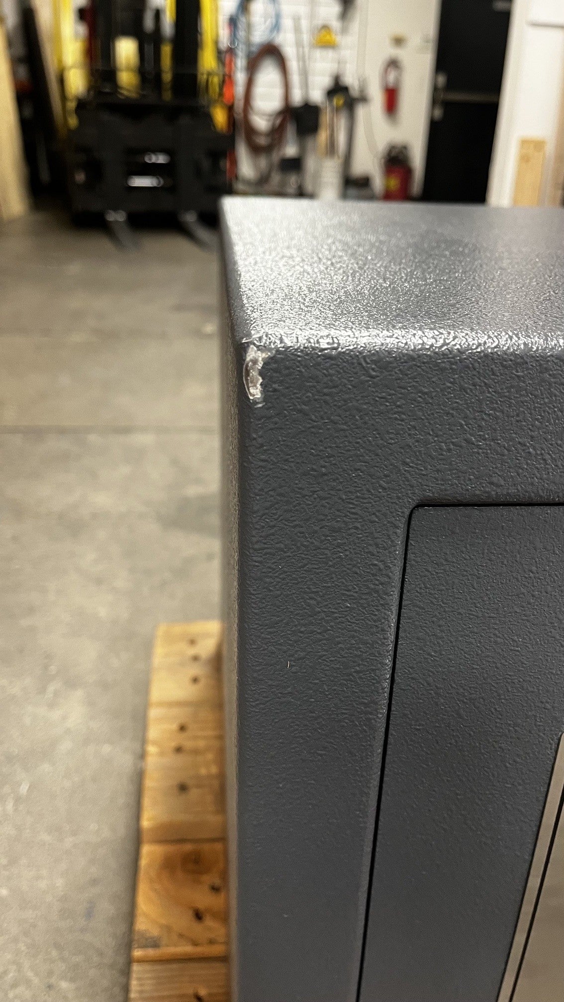 The top left corner has a small chip on the paint. 