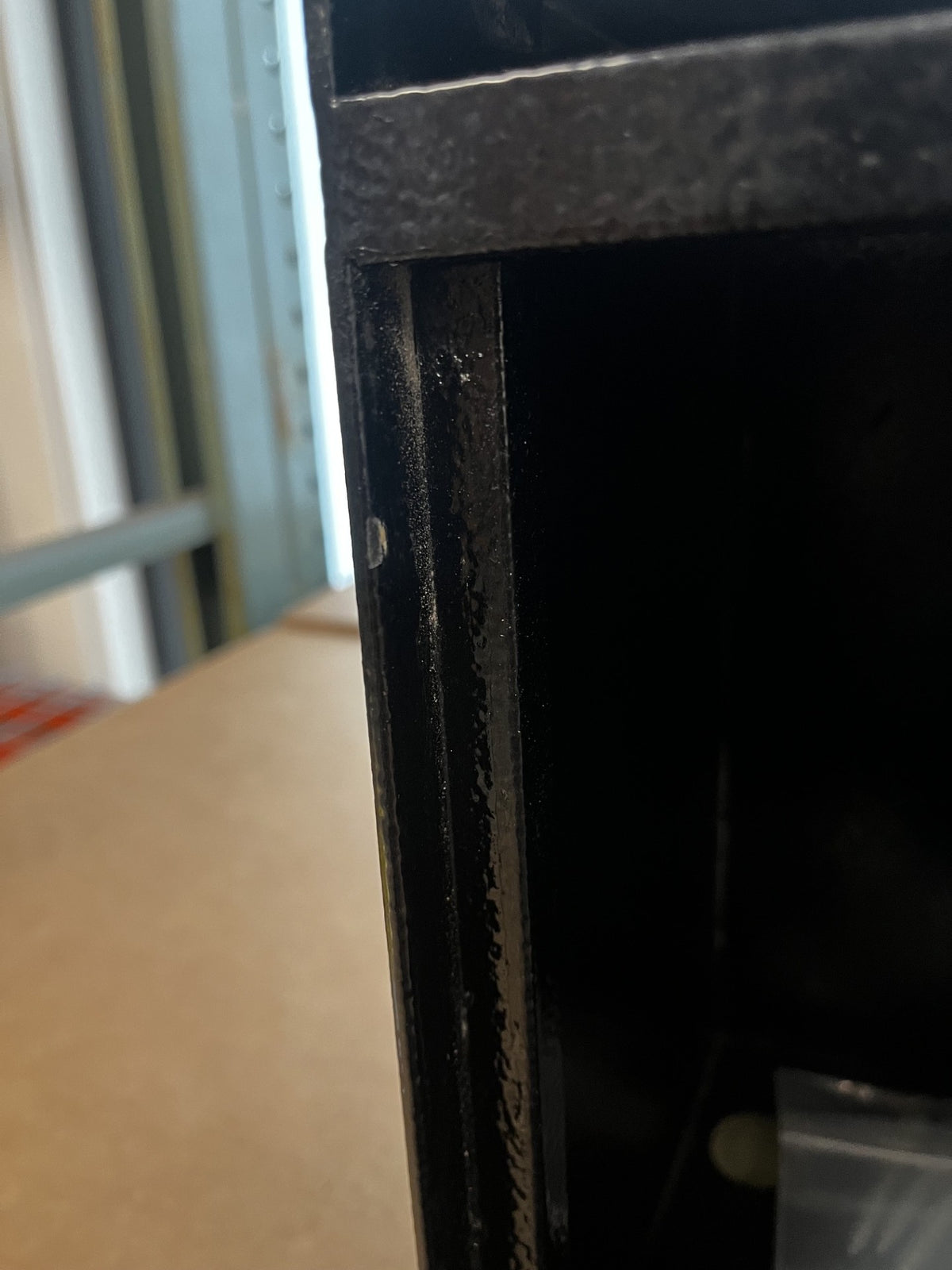 The edge has a small chip on the paint. 