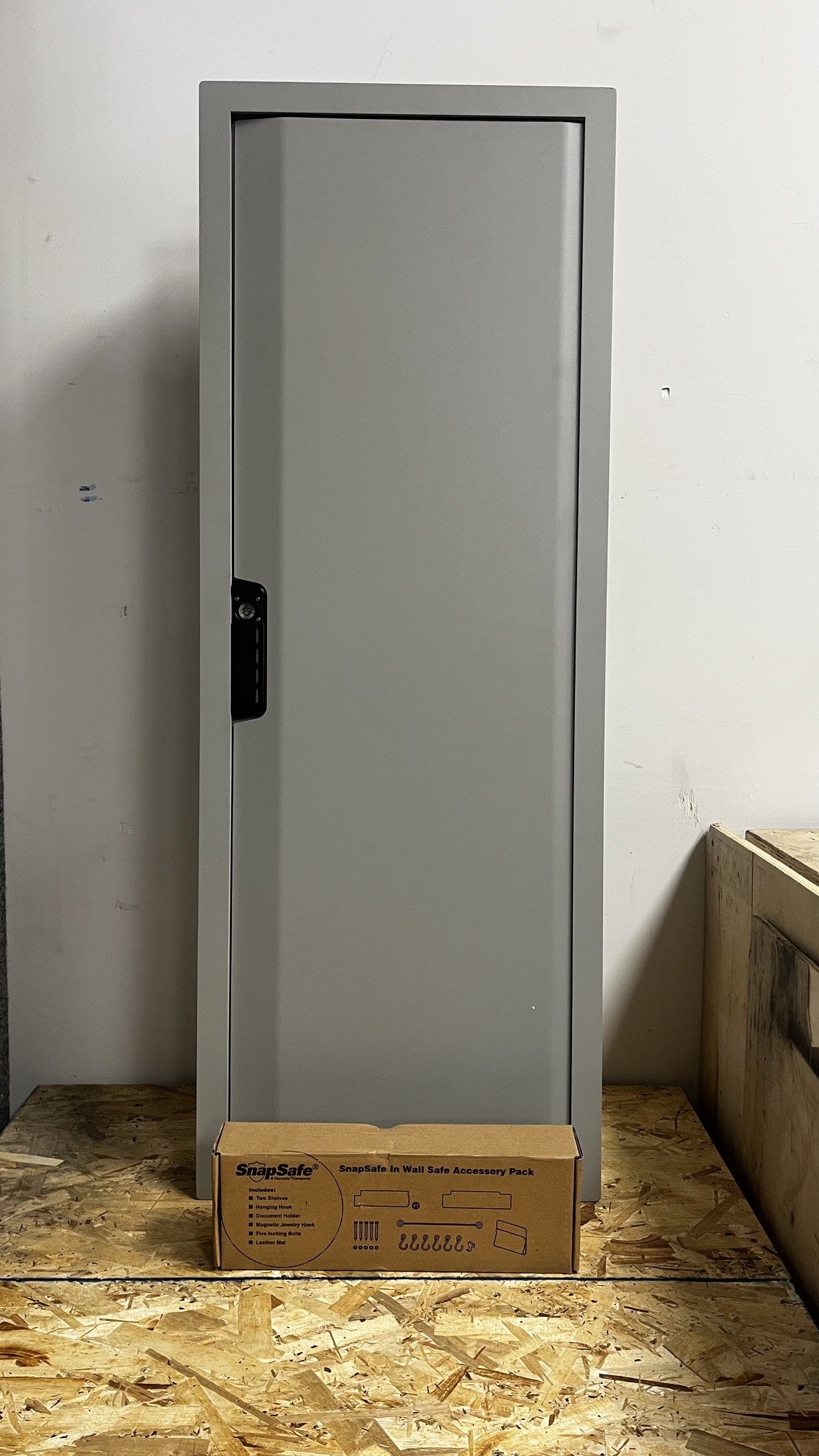 View of the front door of the safe with the accessories pack included. 