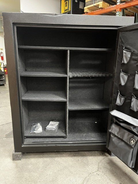 View of the inside of the safe. The safe has 6 adjustable shelves. It has 4 predrilled holes to bolt it down. 