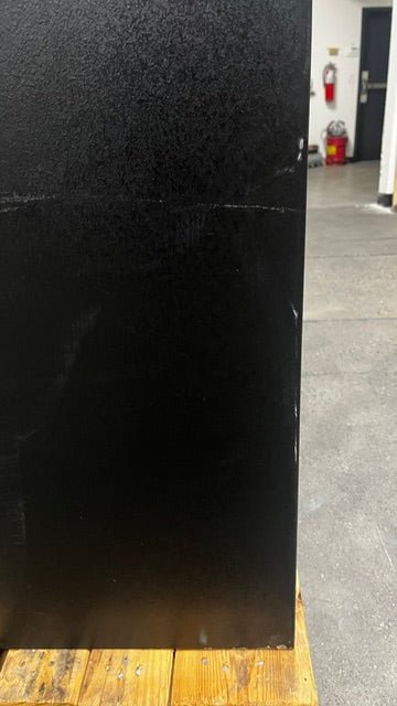 View of small scratches on the lower right side of the safe.  