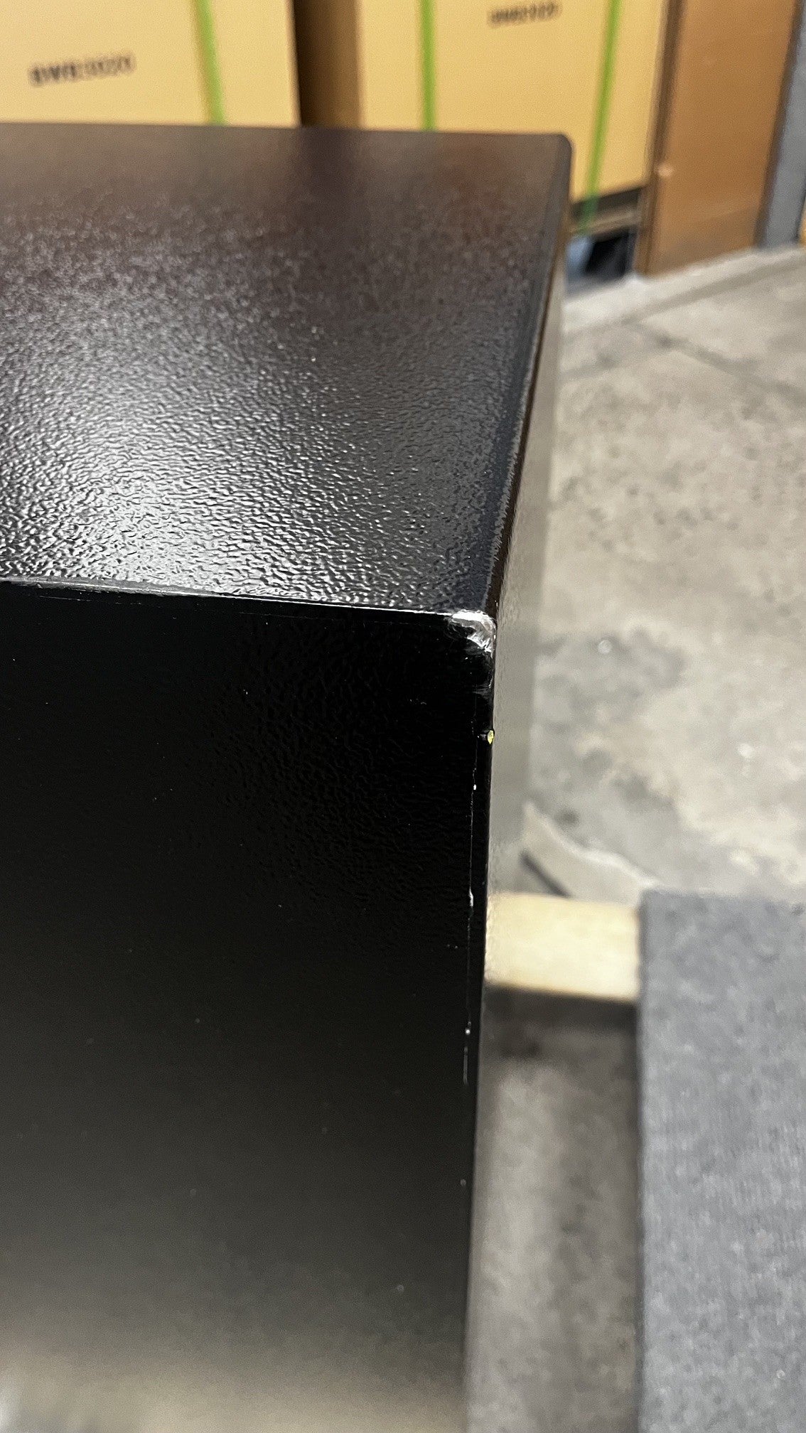 View of the top right corner with chips on the paint. 