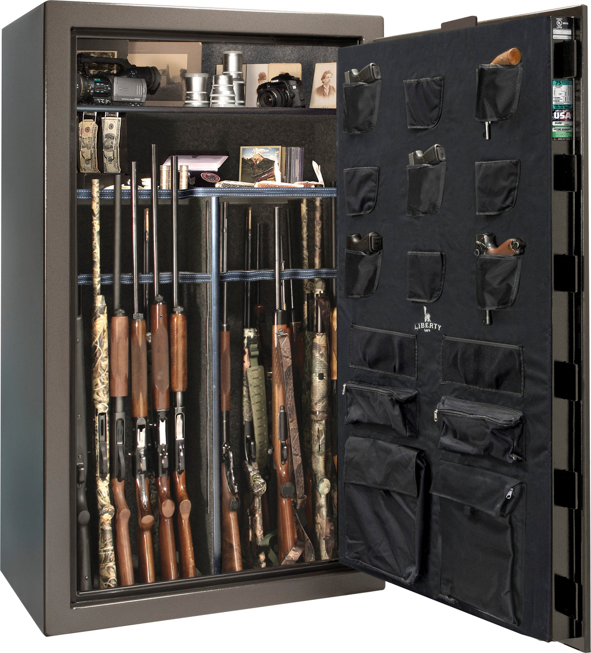Liberty Safe 1776 64-Gun Safe with door open showing camouflage-stocked shotguns and rifles in rack, camera equipment, cash, framed photos, and valuables on shelves, with Liberty-branded canvas door panel storing multiple pistols and documents