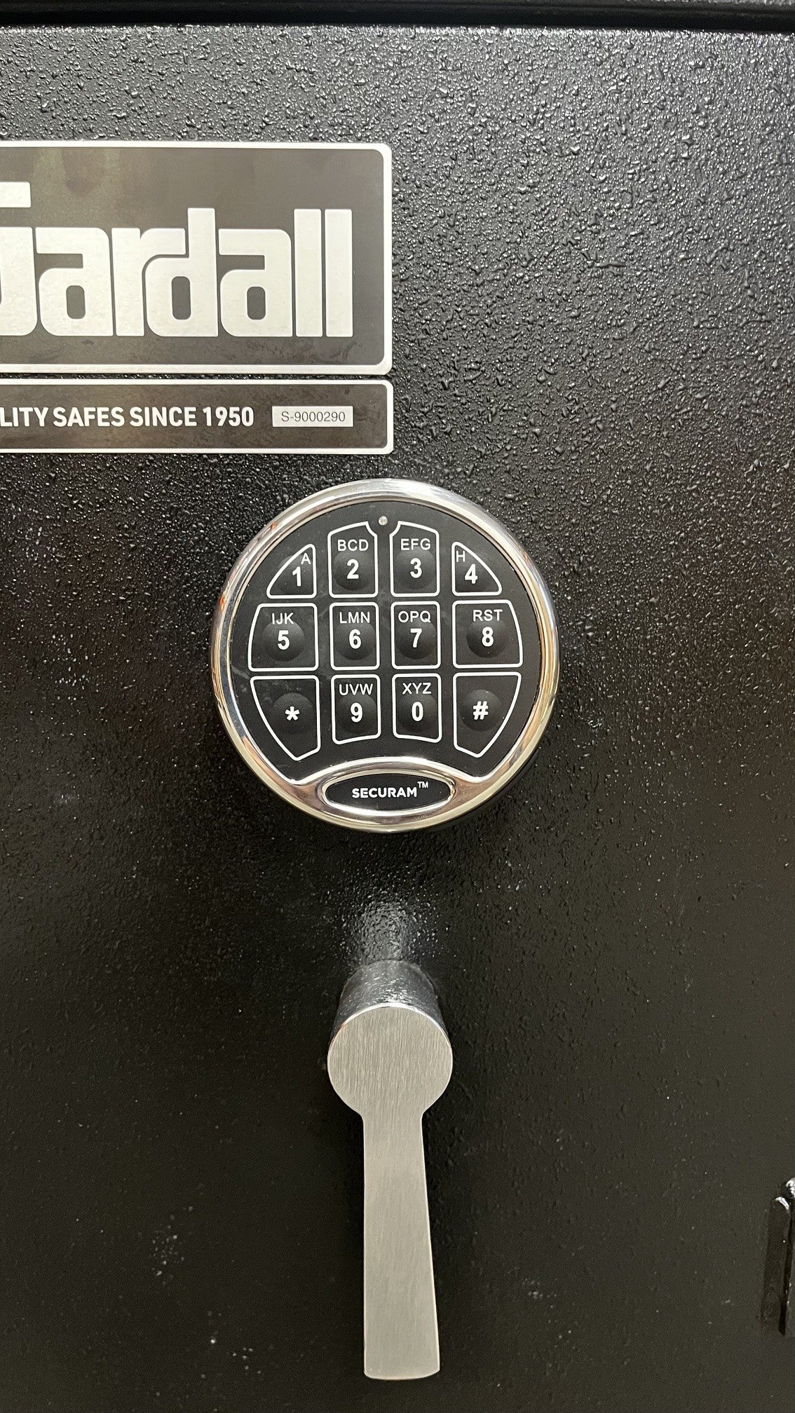 Close-up view of the digital lock and handle. 