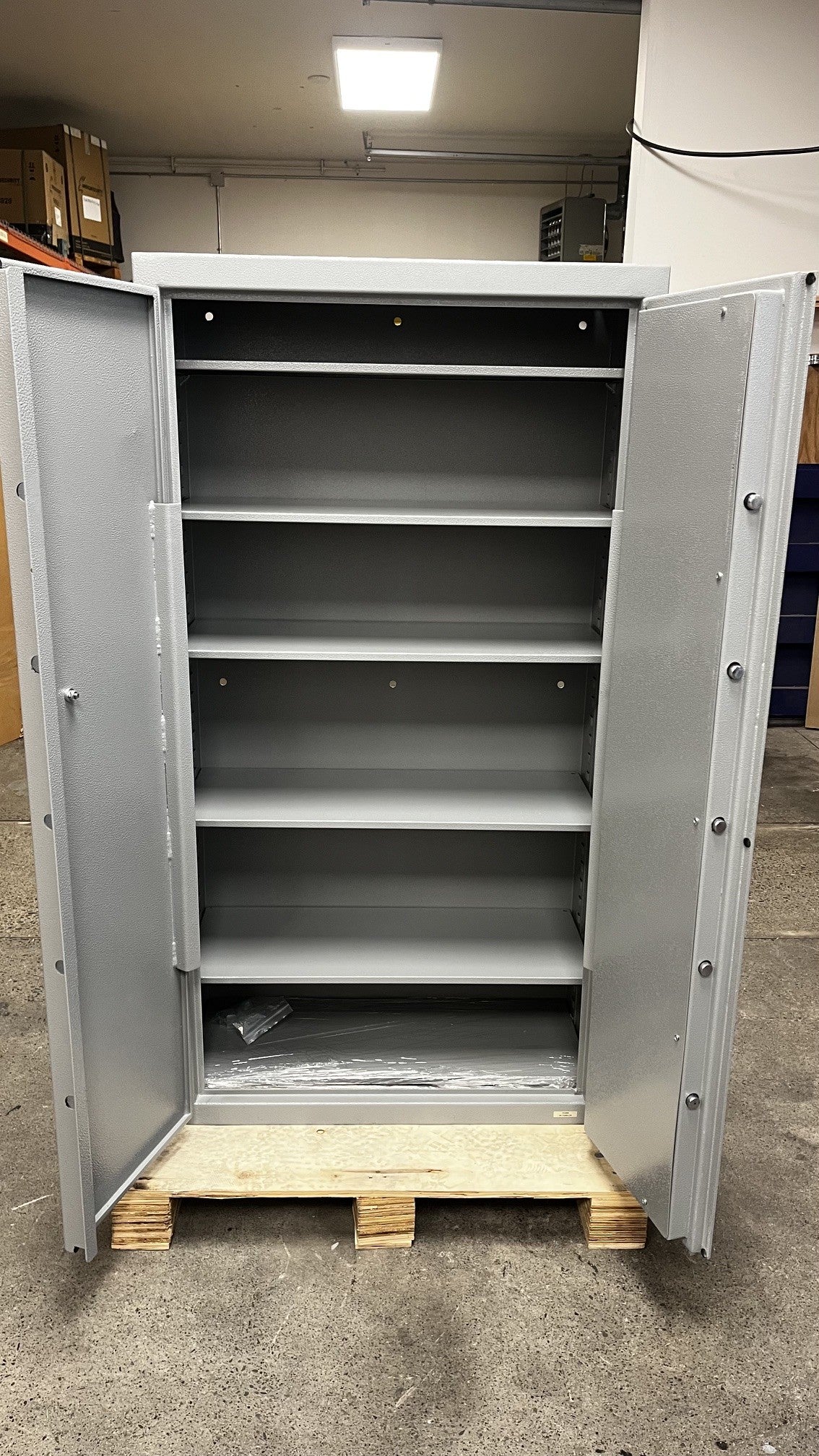 View of the safe with the doors open. It comes with 7 adjustable shelves. The other two are in very bottom of the safe. 