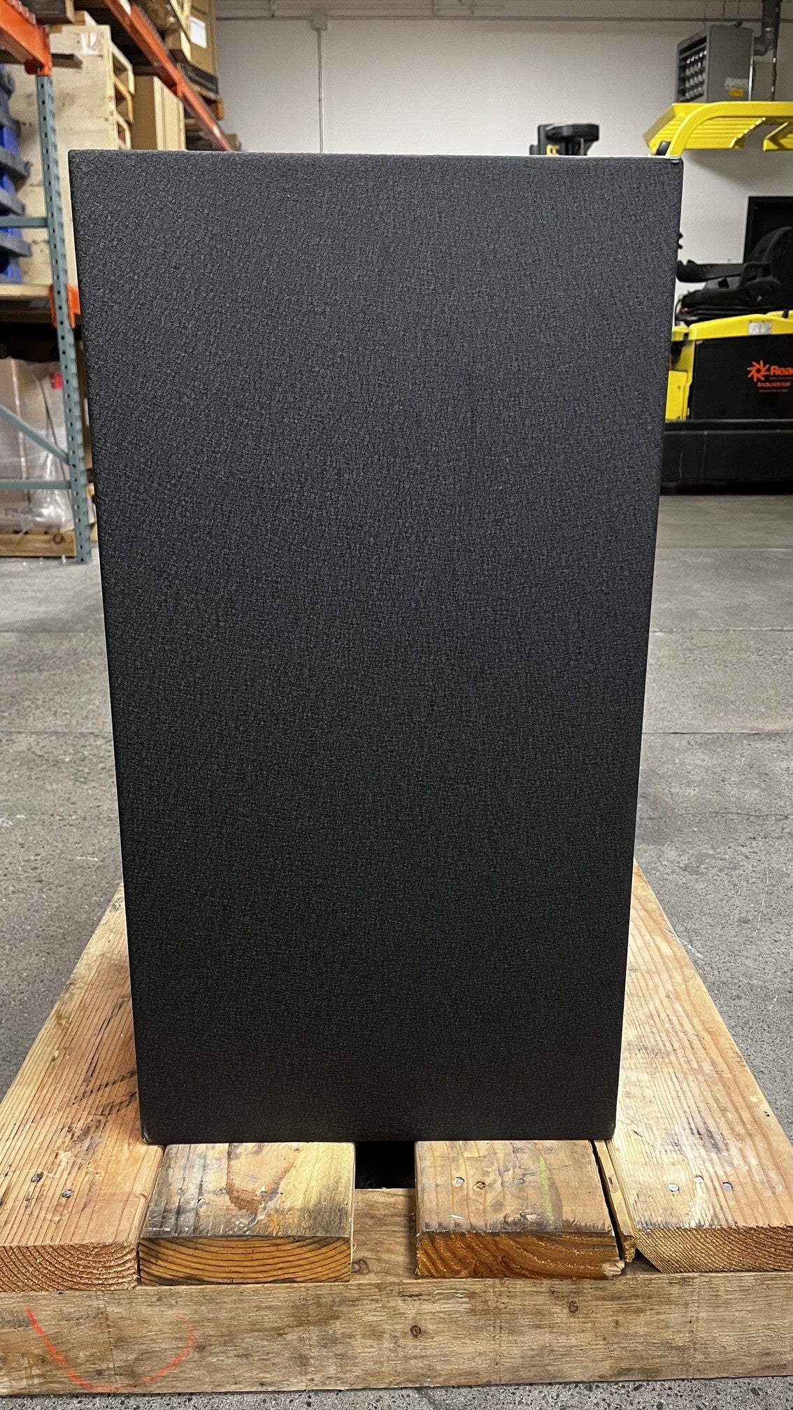 View of the left side of the safe. The lower left side has a small chip. 