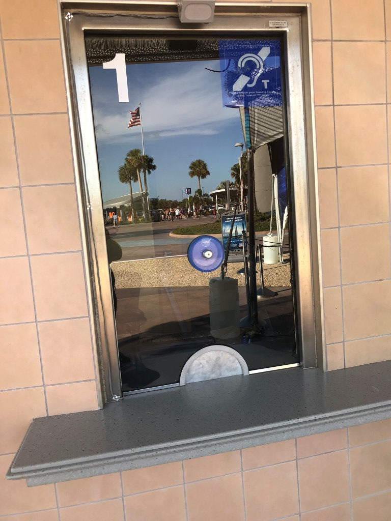 Contacta STS-K020-S23 installed at a ticket window with the STS-C100 blue microphone mounted through the security glass