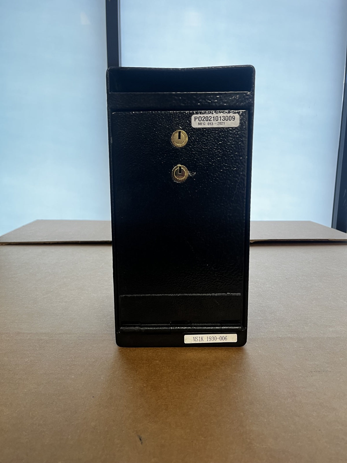 View of the front of the safe, it has a dual key access lock. 