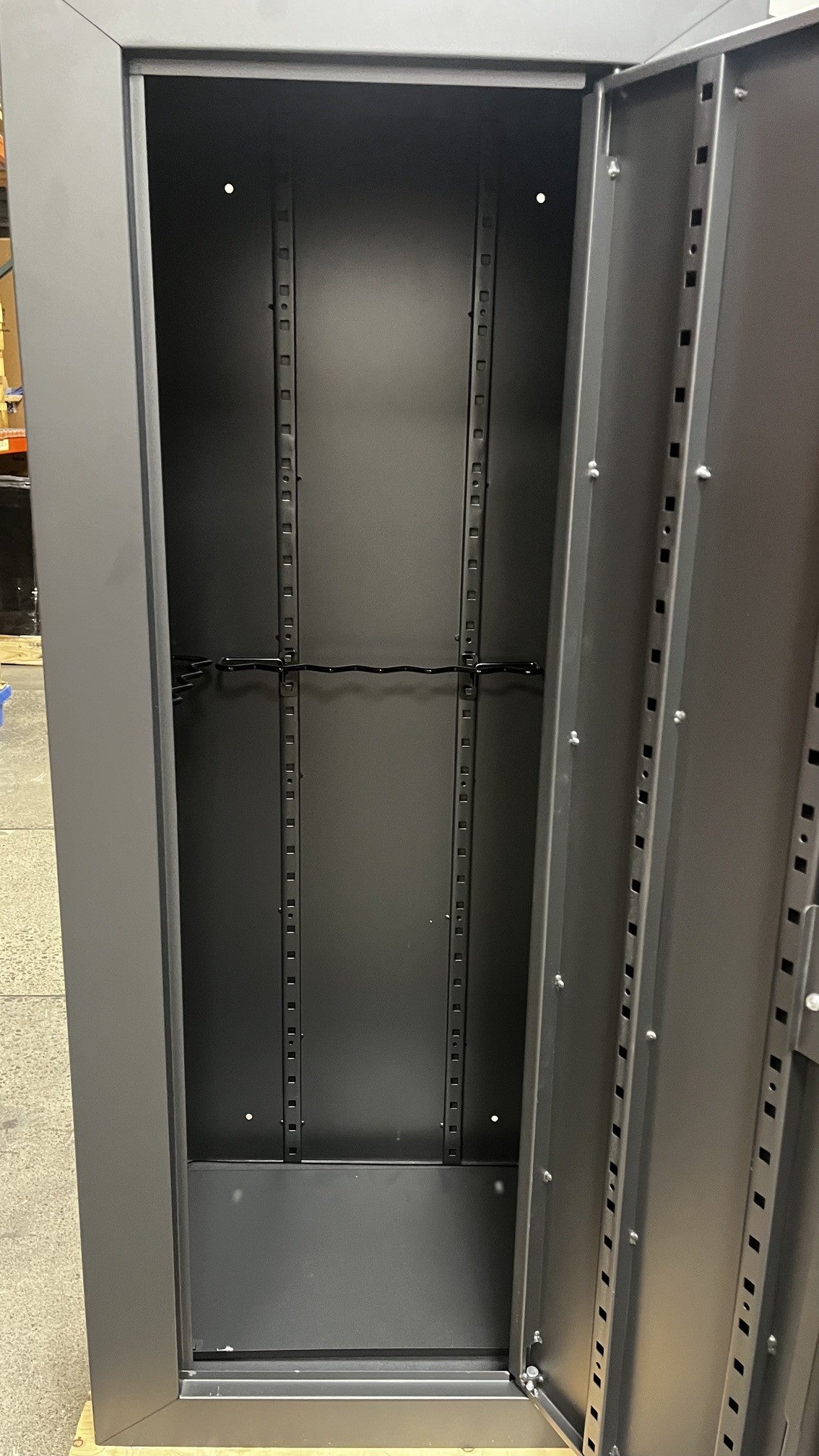 View of the inside of the safe. It comes with an adjustable shelf and gun racks. 