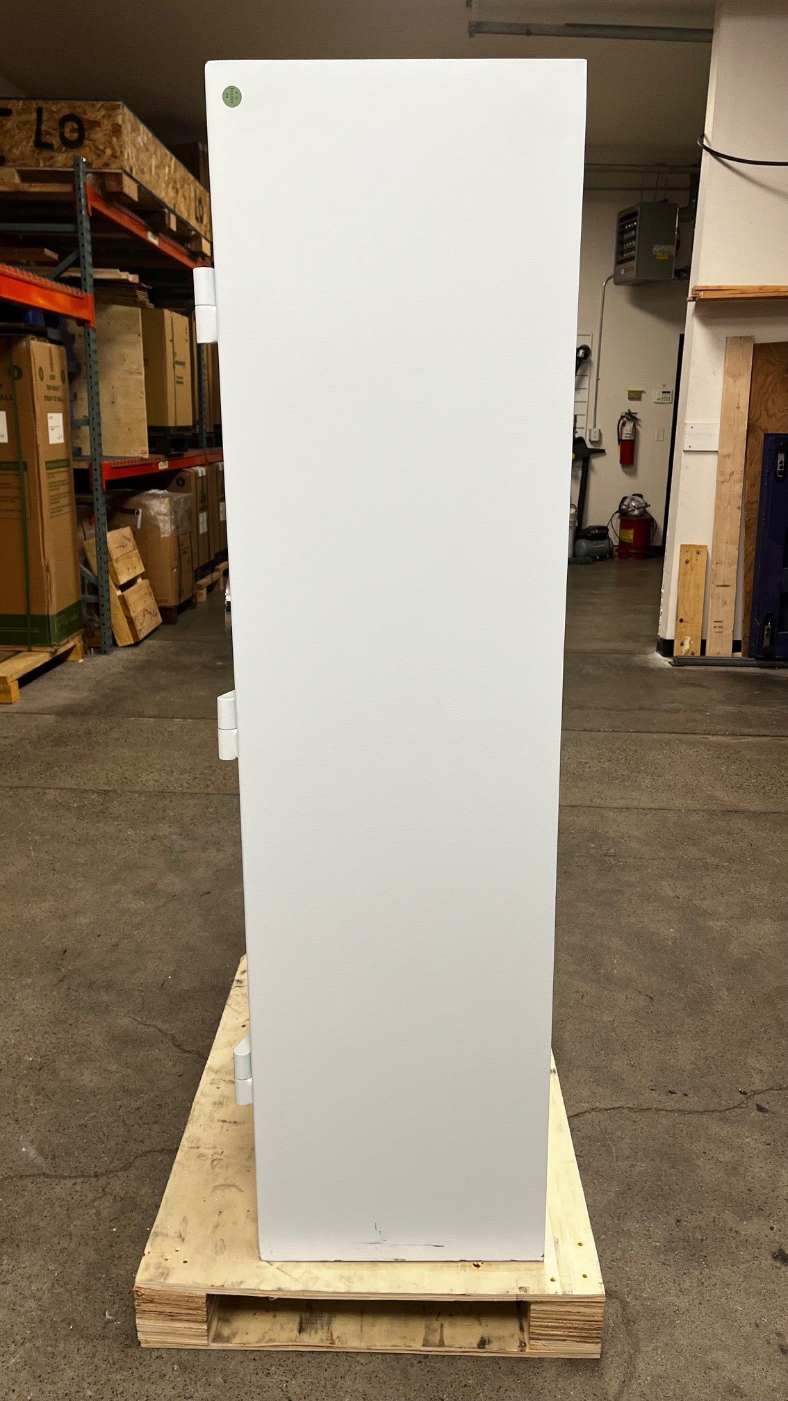 View of the right side of the safe. The lower area has some scratches on the paint. 