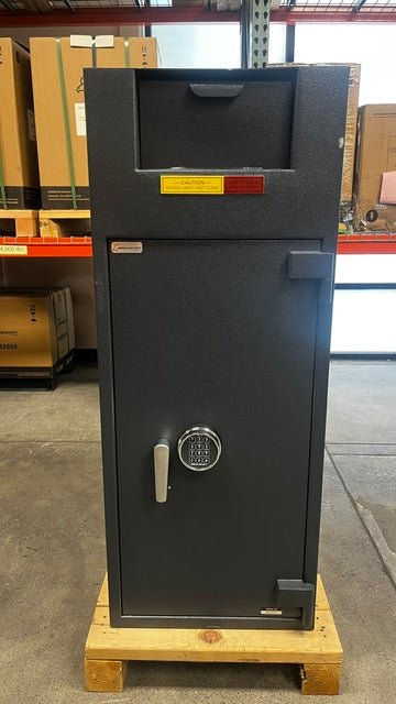 Front view of the safe, the safe has a chip on the paint close to the right edge of the safe. 
