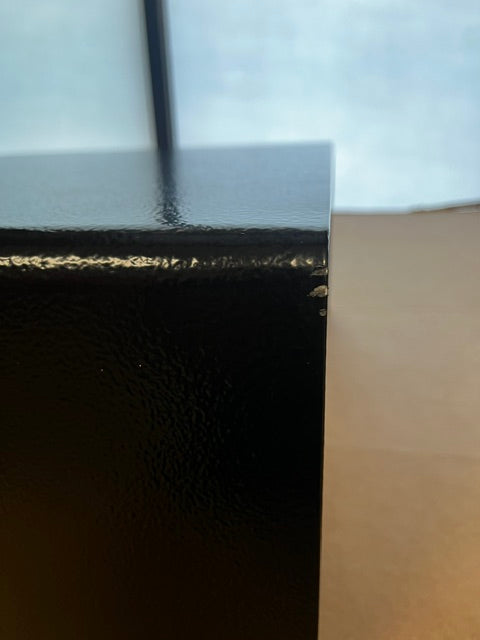 Close-up of the second scratch on the back top right corner. 
