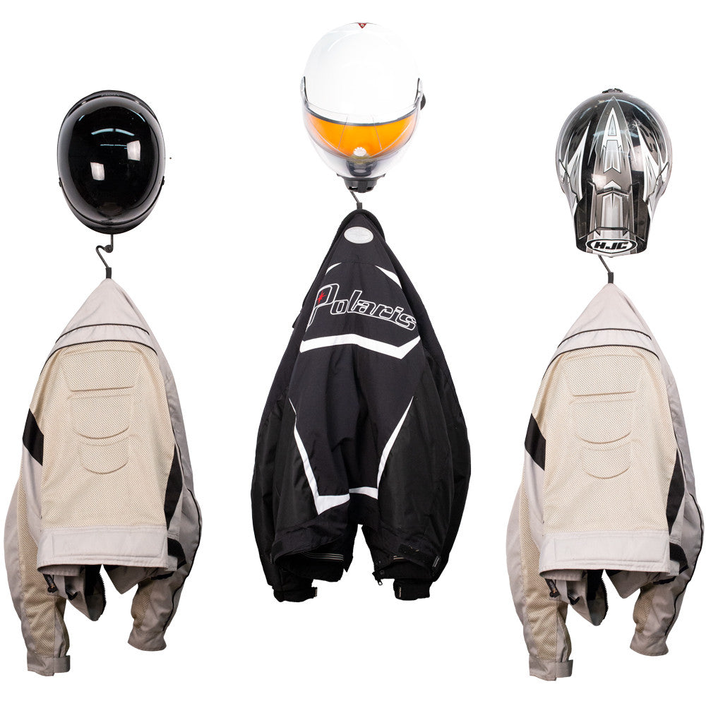 Motorcycle jackets and helmets hanging on a rack with 'Polaris' branding.