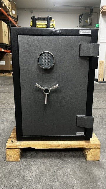 Front view of the safe, the safe comes with an ESL10 digital lock. The top edge of the safe has a dent. 