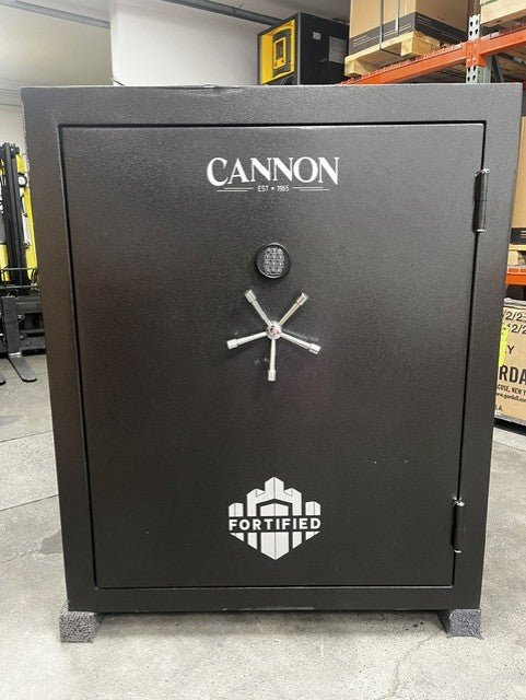 Front view of the safe, the top edge has a dent and chip on the paint. 