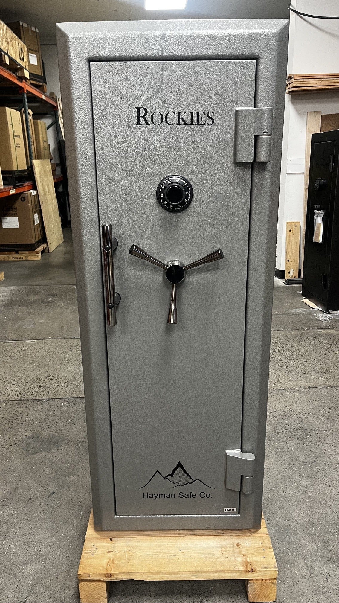 Frnt view of the safe. The safe has some scratches on the middle right above where it says "ROCKIES". The top right hinge also has a small dent. 