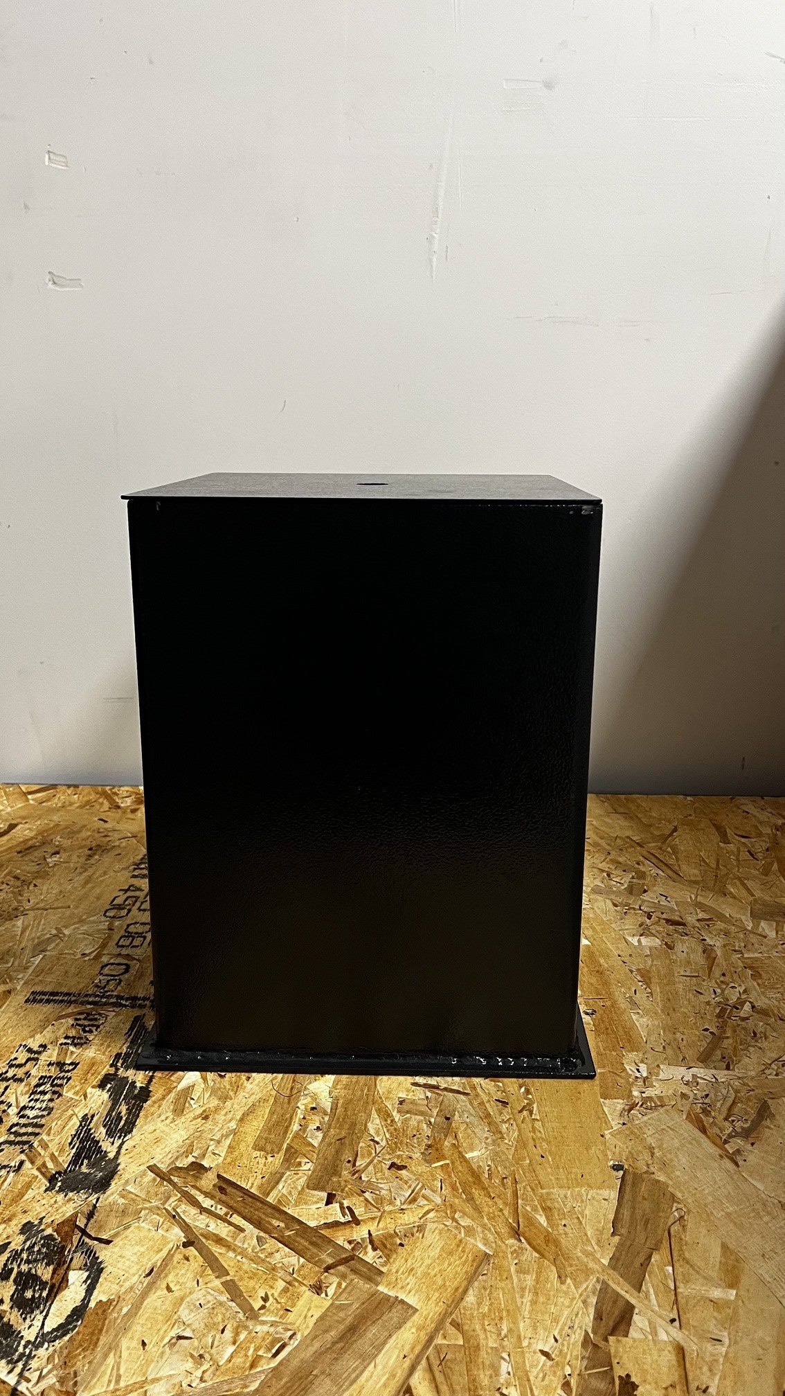 View of the outside of the safe, it has a small chip on the paint on the top right corner. 