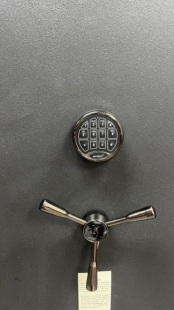 View of the Securam digital lock and three spoke handle. The logo on the middle of hand has some scratches on it . 