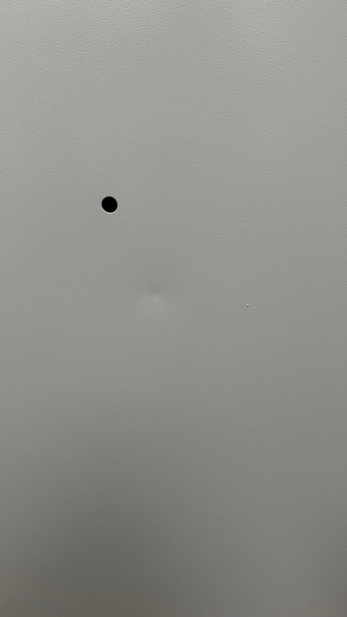 There is a small bent on the back of the safe close to one of the mounting holes. 