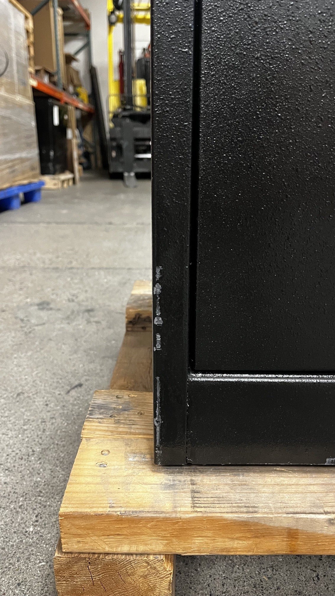 Close-up of the scratches alongside the left edge of the safe. 