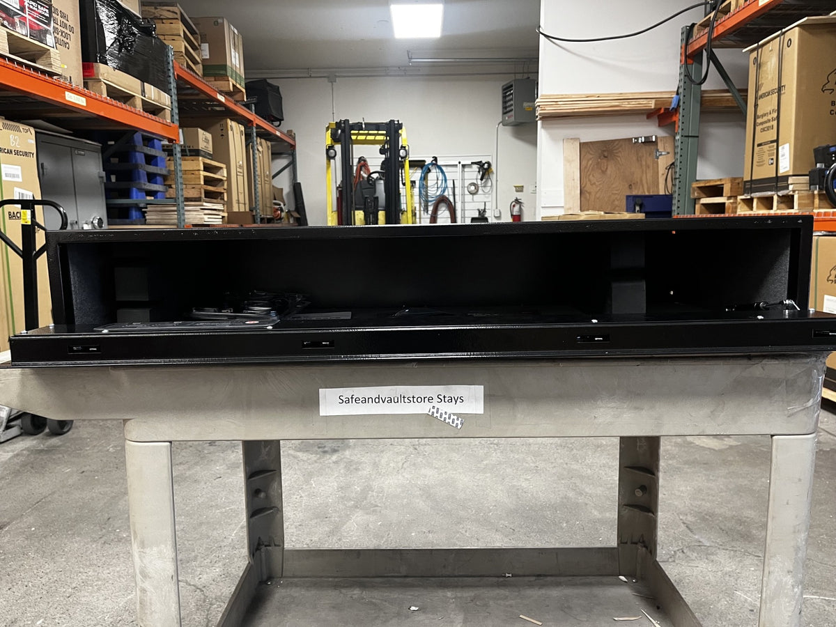View of the safe with the door open. It comes with 1 RFID wristband, 2 RFID decals,1 RFID key fob tag, 2-barrel keys, security cable, and removable foam inserts. 