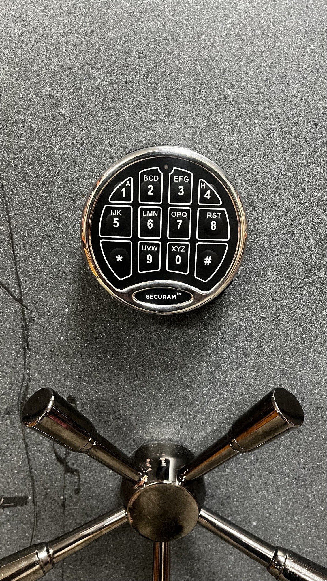 Close-up view of the digital lock. The spoke handle as some scratches. 