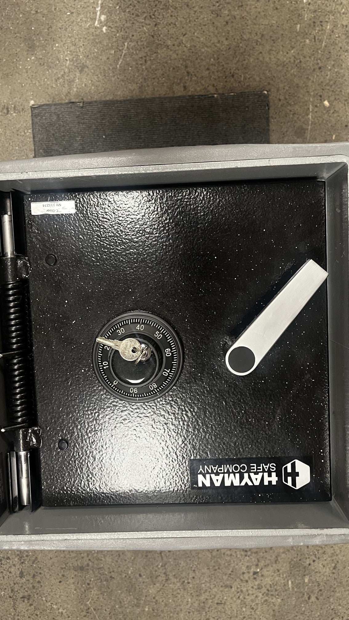 Top view of the door with the keys inside the key-locking dial. 