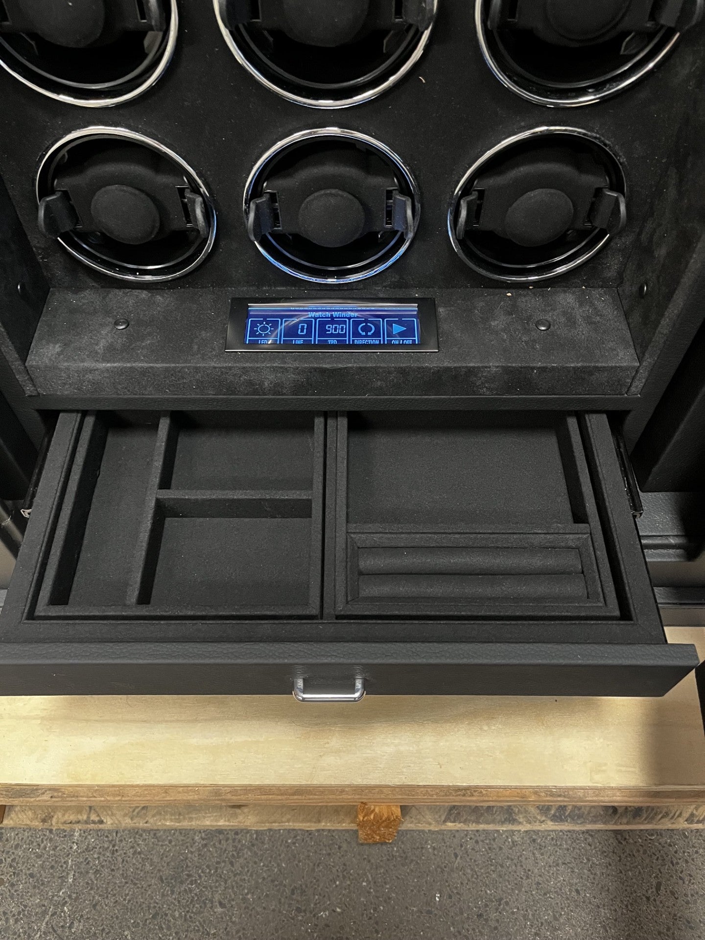 View of the front safe. It has a fingerprint scanner lock with a keypad.  