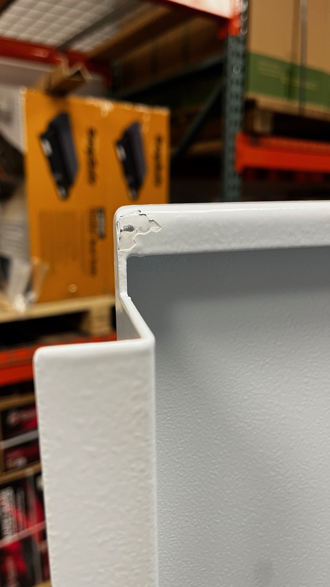 The top right corner of the left door has a chip on the paint. 