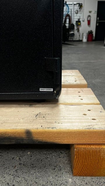View of the bottom right corner, it has a dent on the corner. 