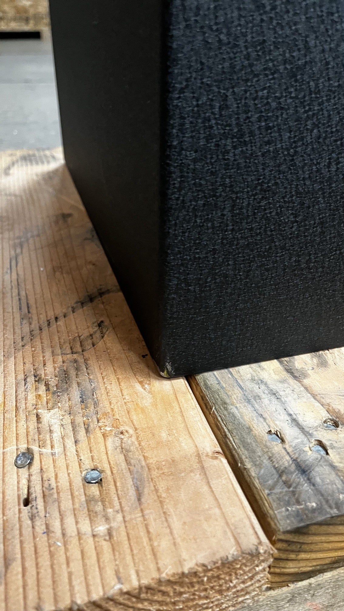 Close-up view of the small chip on the left corner on the bottom of the safe. 