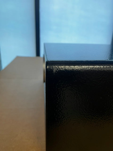 Close-up of one of the scratches on the safe. This one is on the top left corner. 