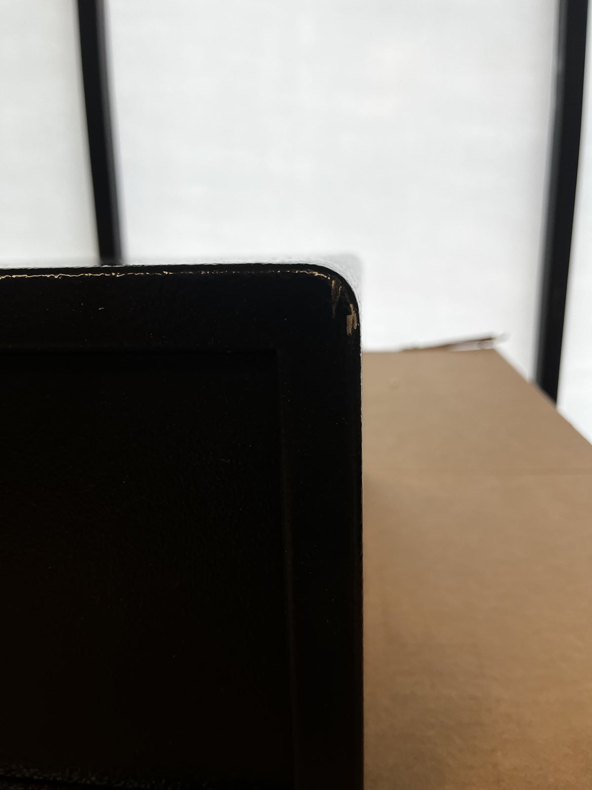 The front top right corner has a chip on the paint. 
