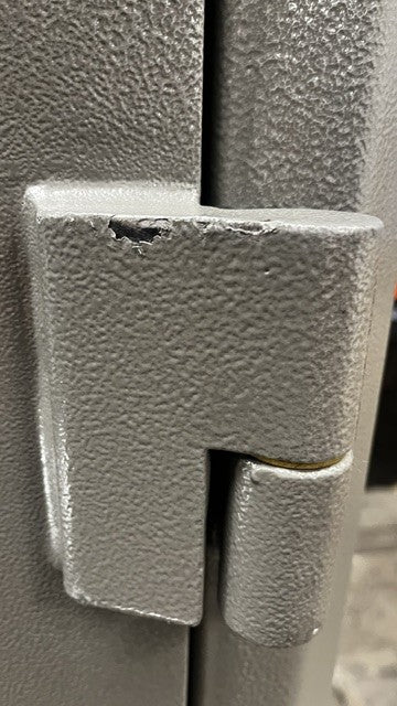 View of the top right hinge, it has a few chips on the paint. 