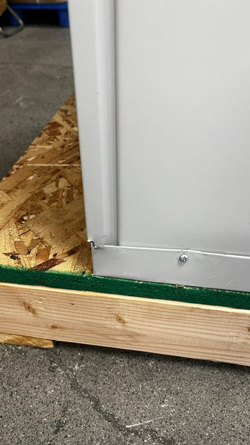 The lower back left corner has a small dent on the edge 