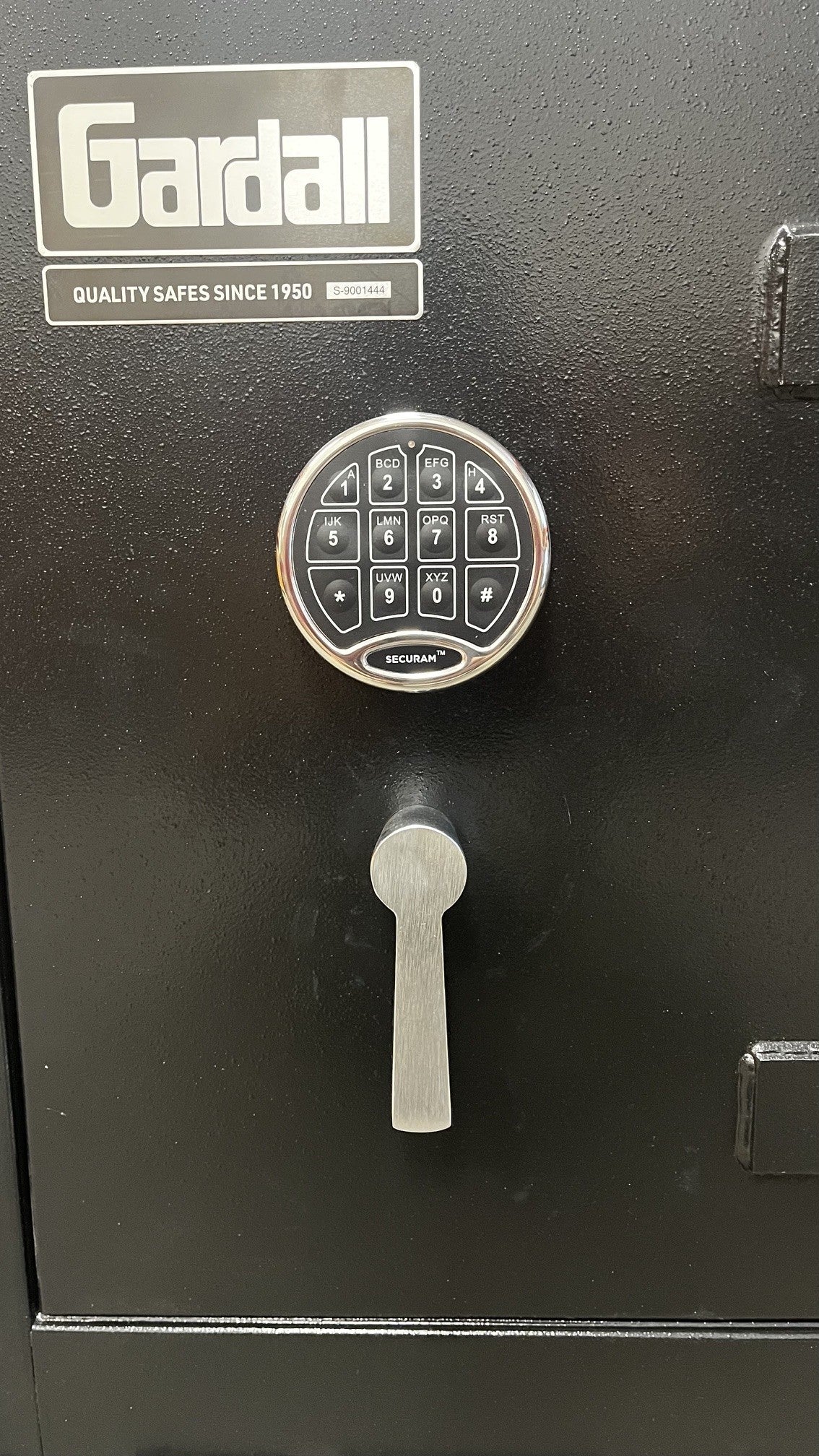 Close-up view of the digital lock. The lock is a Securam single user lock. 
