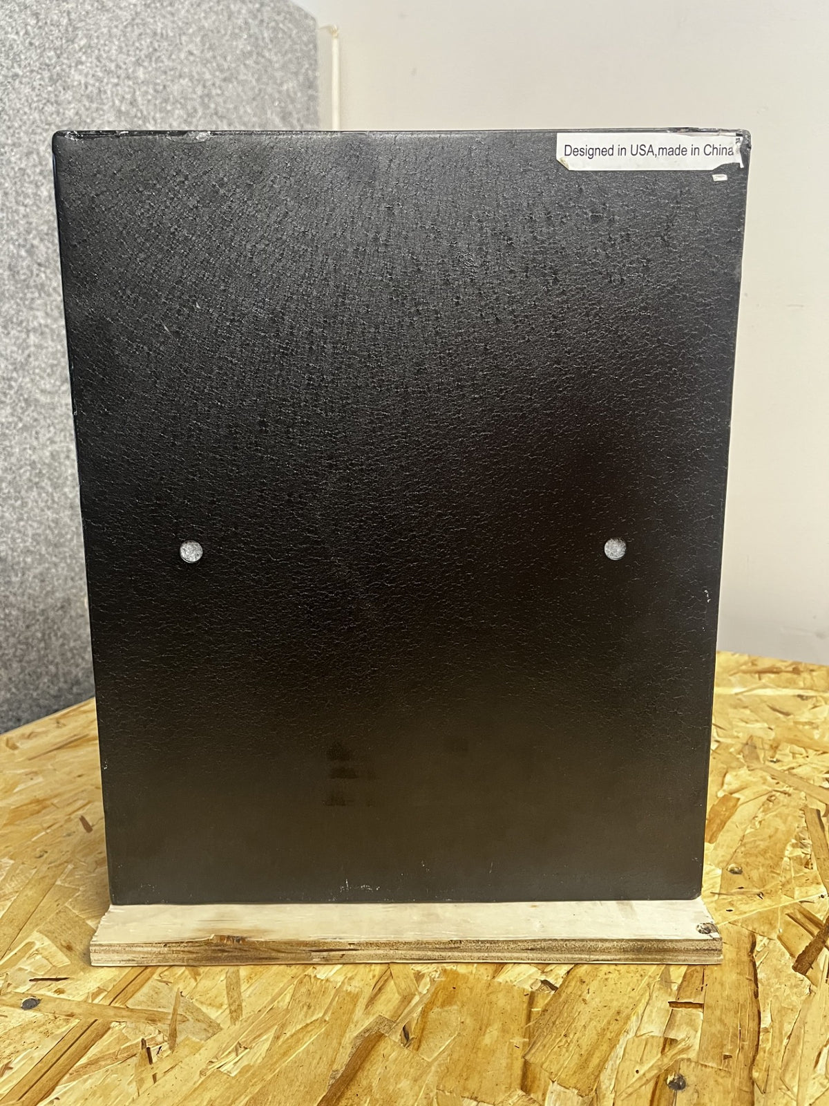 View of the back side of the safe. It has two predrilled holes on the back. 