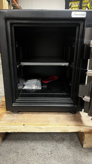 Inside view of the safe, the safe has one adjustable shelf. The safe also includes the bolt screw. 