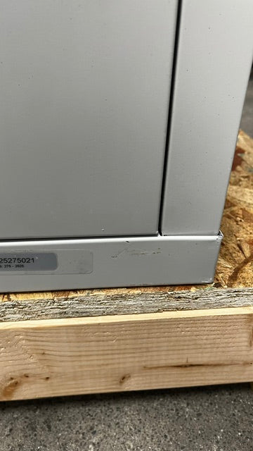 View of a scratch on the bottom front of the unit. 