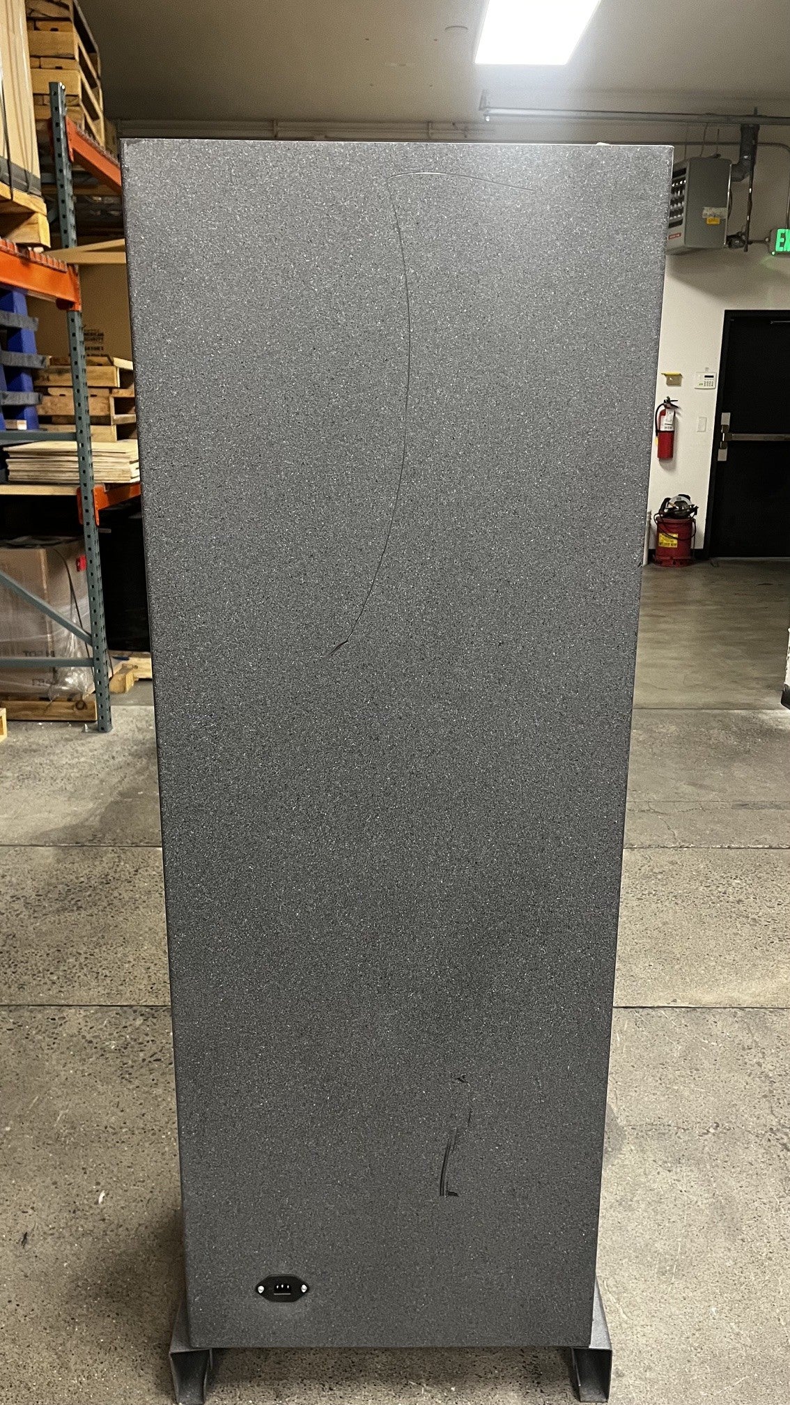 Back view of the safe. The back has a few scratches on the top are going down the middle of the safe. The lower area has a scratch as well. 