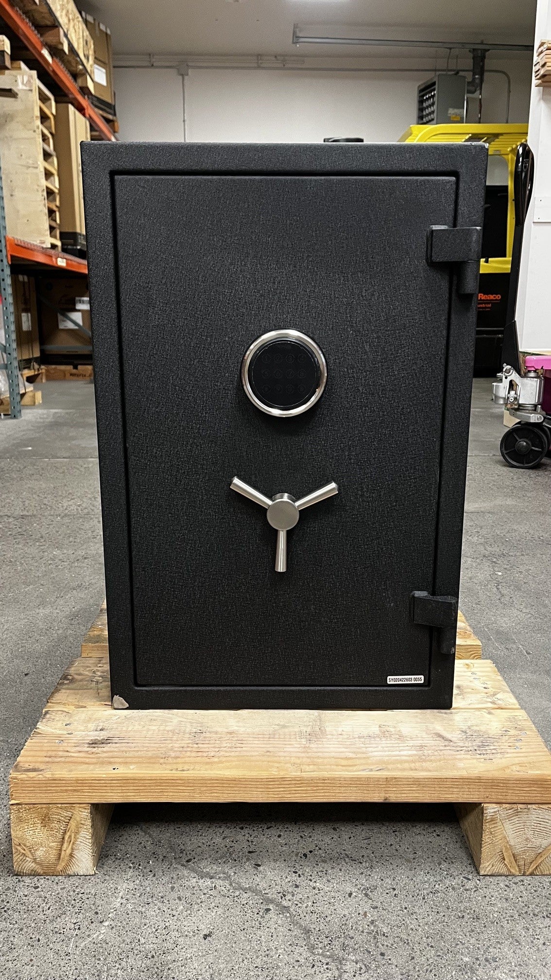 Front view of the safe the bottom left corner has a chip on the paint. 