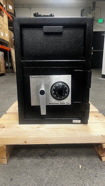 Front view of the safe, the safe has a mechanical dial lock. 