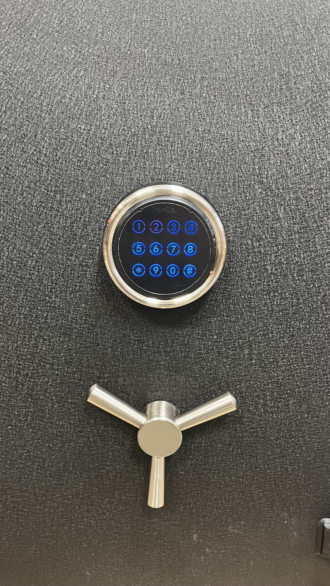Close-up view of the digital lock. The keypad has built in light that comes on once the keypad touched. 