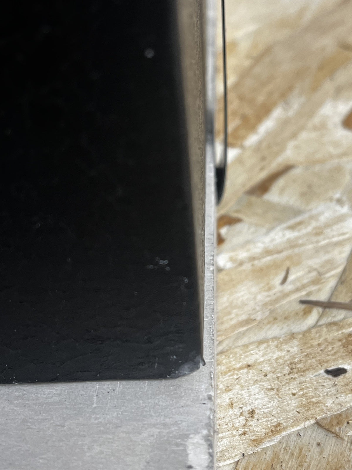 View of a dent on the corner of the safe. 