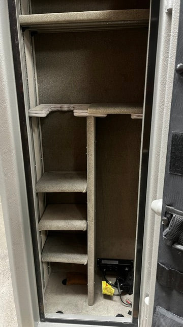 View of the inside of the safe, it has four adjustable shelves, four predrilled bolt down holes. A 110 volt / USB power supply and a LED light kit. 