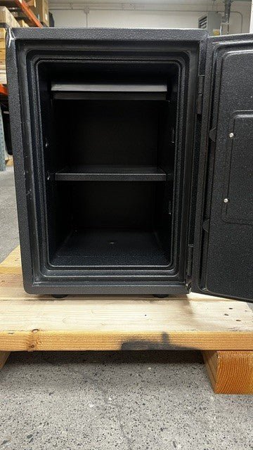 View of the inside of the safe. It comes with one adjustable shelf and tray. 