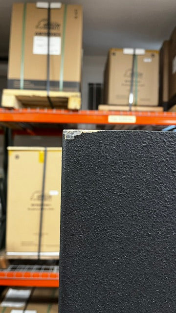 Close-up of the chipped paint on the top left corner of the safe. 